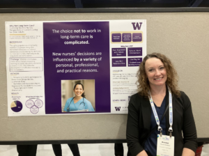 Dr. Kristen Childress standing in front of a research poster